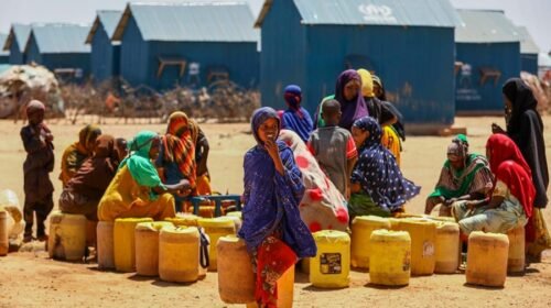 Dollow (Somalia), 30/01/2024.- Women and children gather to fetch water at one of the water points within the Ladan Internally Displaced Persons (IDP) camp in Ladan, on the outskirts of Dollow, in Jubaland state, Somalia, 30 January 2024 (issued 26 February 2024). The Ladan IDP camp hosts some 5500 households of climate change IDPs.In February 2023, the total number of internally displaced people in Somalia reached 3.8 million, while more than one million had newly been displaced in that year only by May. These people have been forced to leave their homes because of climate change and insecurity, two phenomena that prevent them from going back and make their displacement almost permanent. Abdullahi Halakhe, from the organization Refugees International, told EFE. EFE/EPA/DANIEL IRUNGU ATTENTION: This Image is part of a PHOTO SET