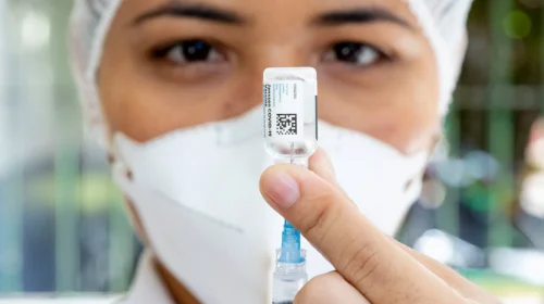 health-worker-covid-19-vaccine-in-hand-1500