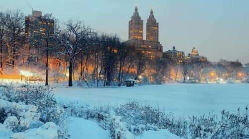 Central Park winter at night with skyscrapers in midtown Manhattan New York City