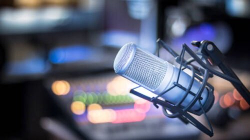 Professional studio microphone, recording studio, equipment in the blurry background