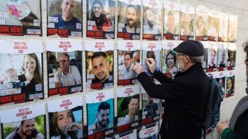 Jerusalem (---), 10/01/2024.- A man fixes one of many pictures of Israelis held hostage in Gaza, Jerusalem, 10 January 2024. More than 22,800 Palestinians and at least 1,300 Israelis have been killed, according to the Palestinian Health Ministry and the Israel Defense Forces (IDF), since Hamas militants launched an attack against Israel from the Gaza Strip on 07 October, and the Israeli operations in Gaza and the West Bank which followed it. (Jerusalén) EFE/EPA/ABIR SULTAN